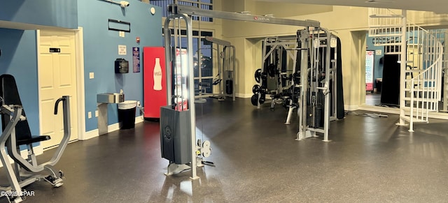 exercise room with baseboards