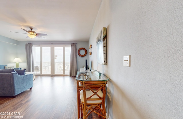 interior space featuring wood finished floors and a ceiling fan