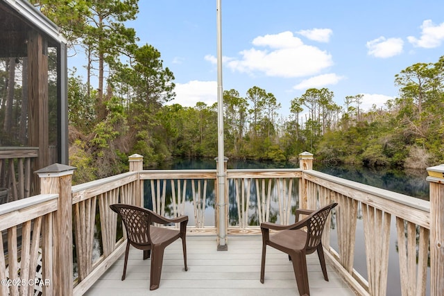 wooden deck with a water view