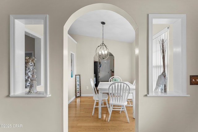 dining room featuring baseboards and wood finished floors