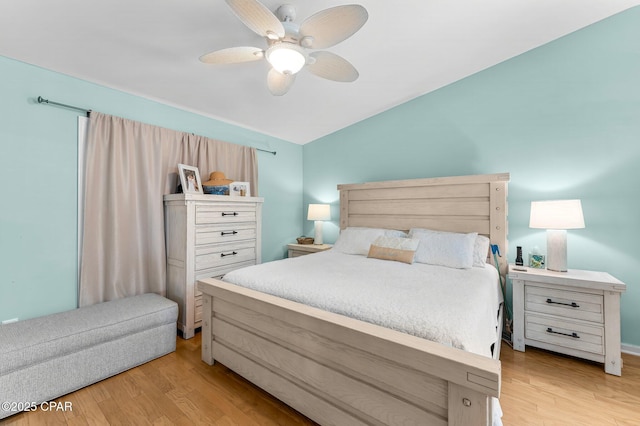 bedroom with ceiling fan and light wood-type flooring