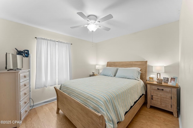 bedroom featuring a ceiling fan and light wood-style floors