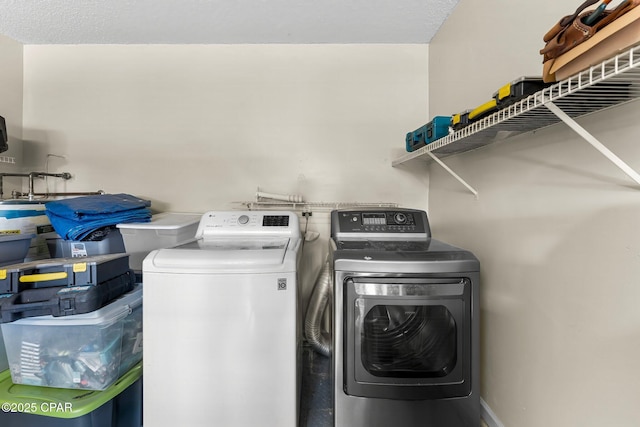 laundry room with laundry area and washing machine and dryer