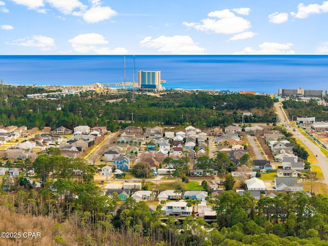 drone / aerial view featuring a residential view and a water view