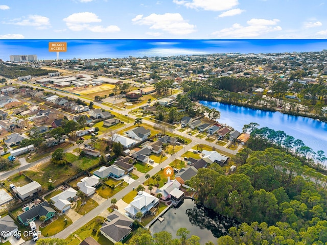 birds eye view of property with a water view and a residential view