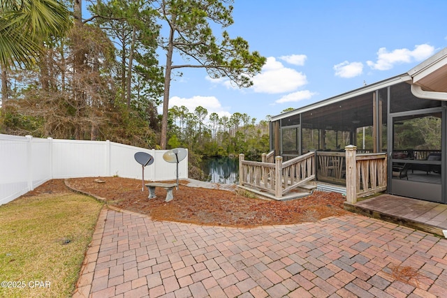 view of patio / terrace with a fenced backyard and a sunroom