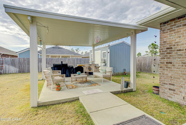 view of patio with a fenced backyard and an outdoor structure