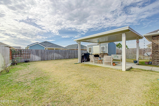 view of yard with a patio area and a fenced backyard