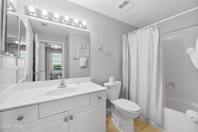 bathroom with ensuite bath, tile patterned floors, toilet, vanity, and visible vents