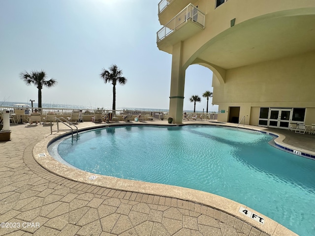 community pool with a patio