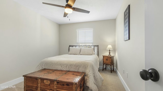 bedroom featuring light carpet, ceiling fan, and baseboards