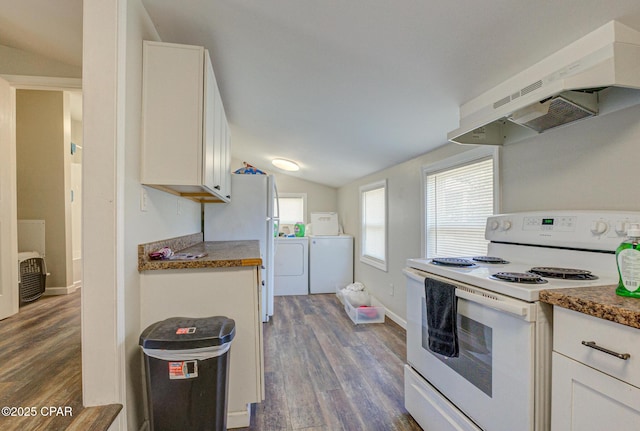 kitchen featuring lofted ceiling, washing machine and dryer, under cabinet range hood, white appliances, and dark wood-style floors