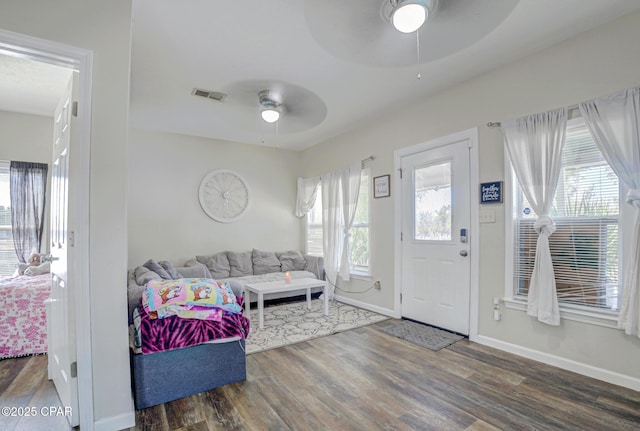 266 N E Ave, Panama City, FL 32401 - foyer entrance with baseboards, a ceiling fan, wood finished floors, and visible vents