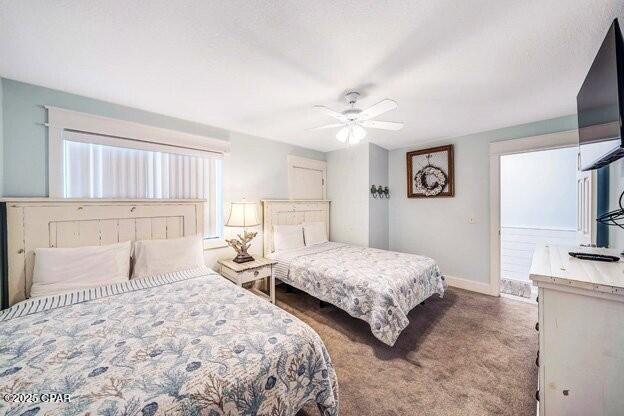 bedroom featuring ceiling fan, carpet floors, and baseboards