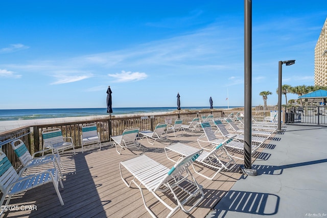 exterior space with a water view and a view of the beach