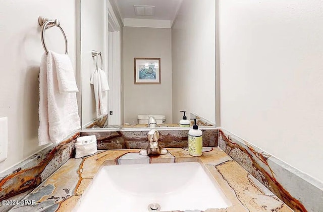 bathroom with vanity and toilet