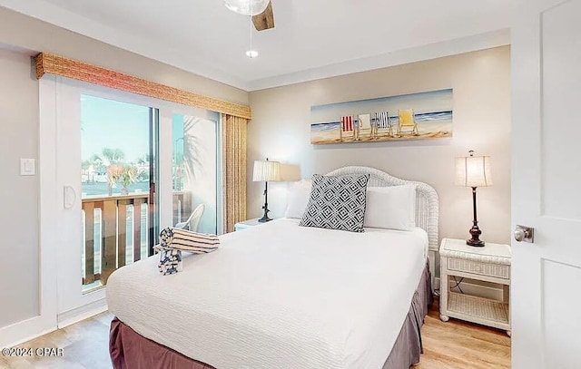 bedroom featuring light wood-type flooring, a ceiling fan, and access to exterior