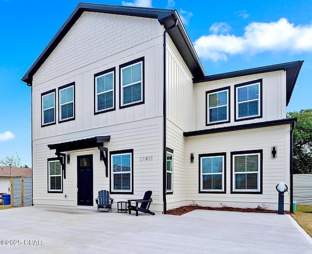 back of property featuring board and batten siding