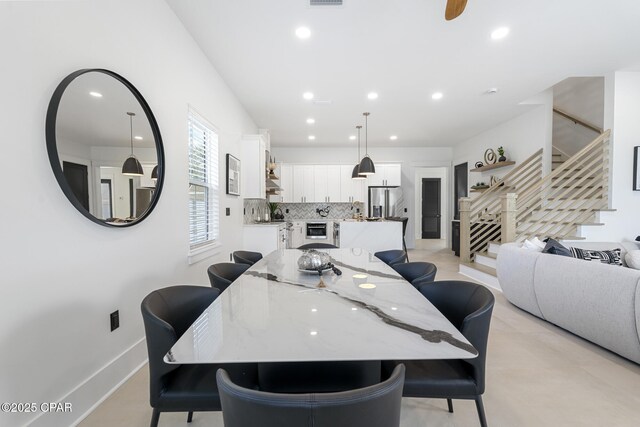 21403 Sunset Ave, Panama City Beach, FL 32413 - dining space with stairway, recessed lighting, and baseboards