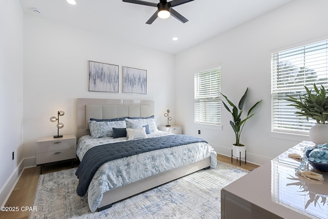 21403 Sunset Ave, Panama City Beach, FL 32413 - bedroom featuring wood finished floors, baseboards, recessed lighting, and a ceiling fan