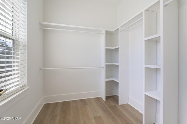 21403 Sunset Ave, Panama City Beach, FL 32413 - spacious closet featuring wood finished floors