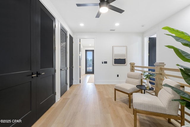 21403 Sunset Ave, Panama City Beach, FL 32413 - hallway with light wood-type flooring, recessed lighting, and baseboards