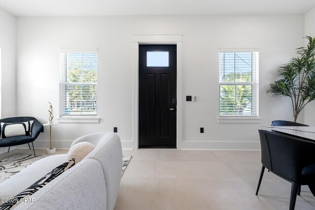 21403 Sunset Ave, Panama City Beach, FL 32413 - entryway featuring baseboards and light tile patterned floors