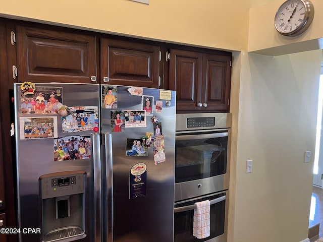 kitchen featuring stainless steel appliances and dark brown cabinets