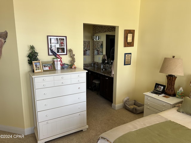 bedroom featuring light carpet and baseboards