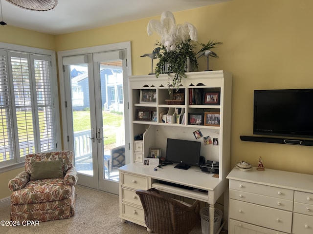 carpeted office space featuring french doors