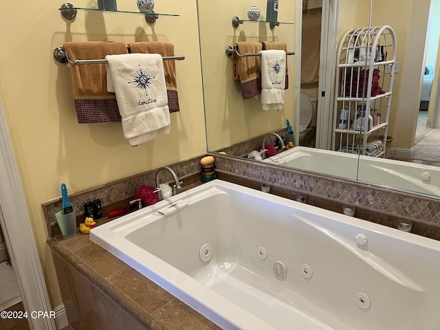 full bath featuring a tub with jets