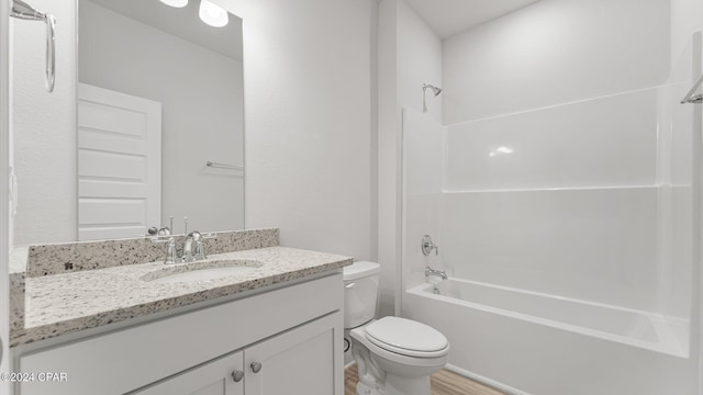 full bathroom featuring shower / bath combination, vanity, toilet, and wood finished floors