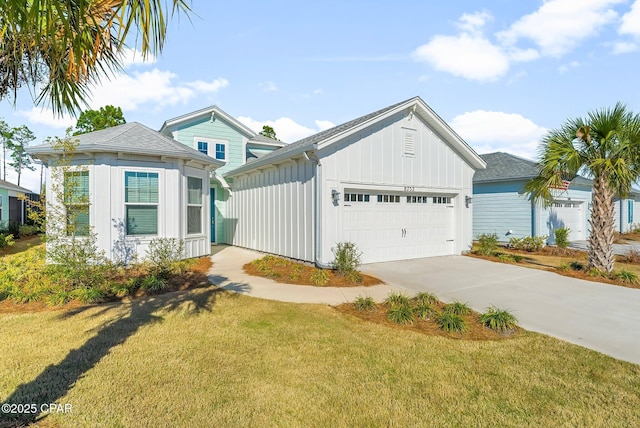 view of front of property featuring a garage, board and batten siding, concrete driveway, and a front lawn