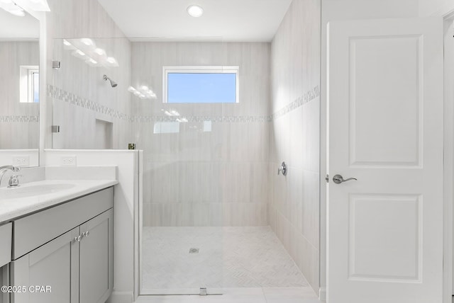 full bath featuring vanity and walk in shower