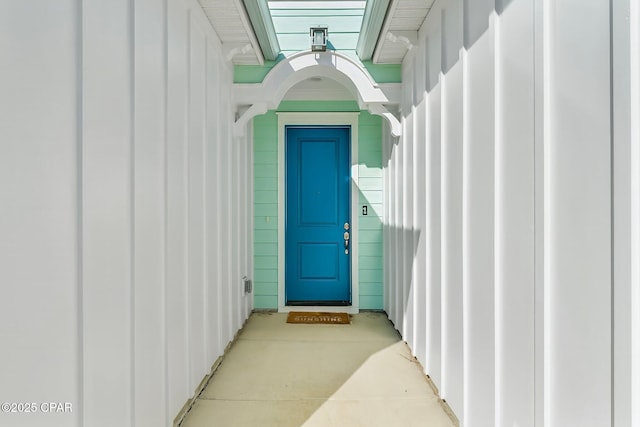 doorway to property with board and batten siding