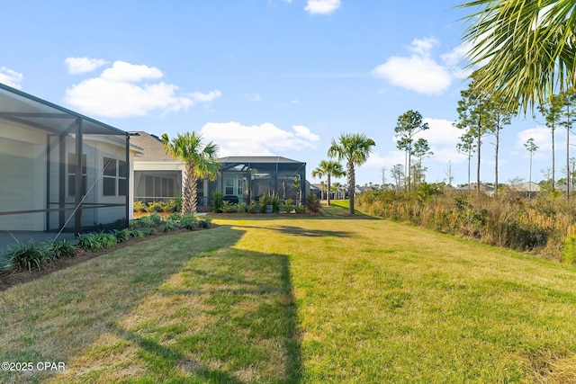 view of yard featuring glass enclosure