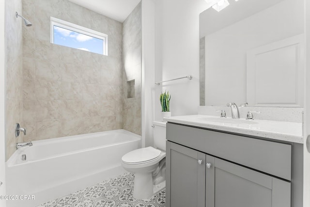 bathroom with tile patterned floors, tub / shower combination, toilet, and vanity