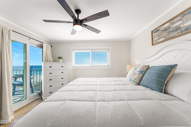 bedroom with a ceiling fan, access to outside, crown molding, and wood finished floors