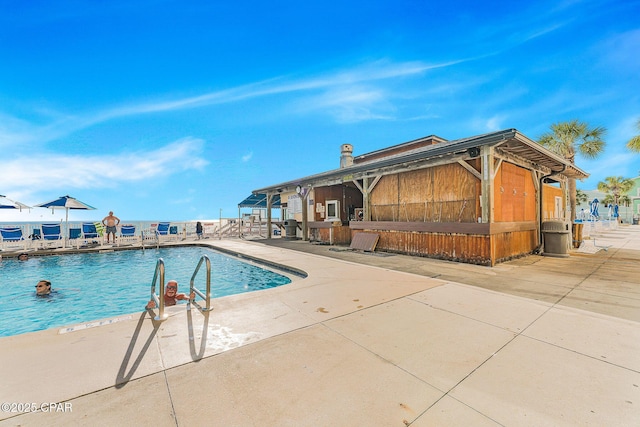 pool with a patio area