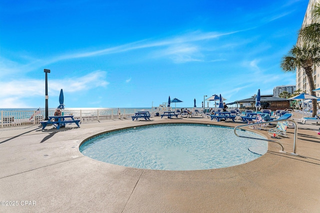 view of swimming pool featuring a patio