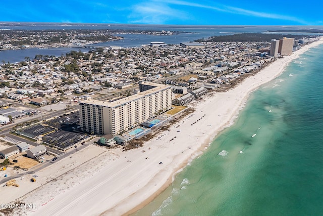 aerial view featuring a water view, a city view, and a view of the beach