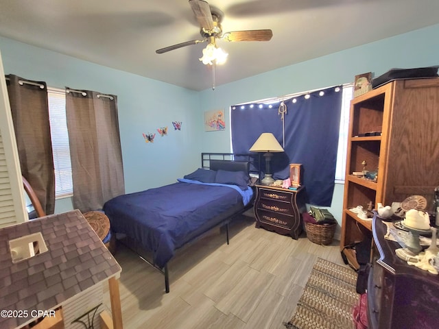 bedroom featuring ceiling fan and light wood-style flooring