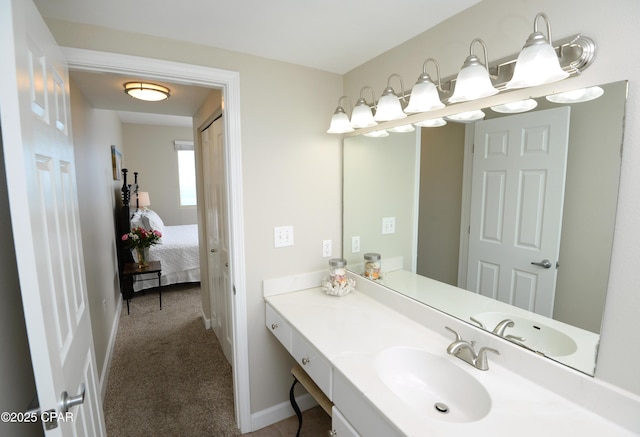 bathroom featuring vanity and baseboards