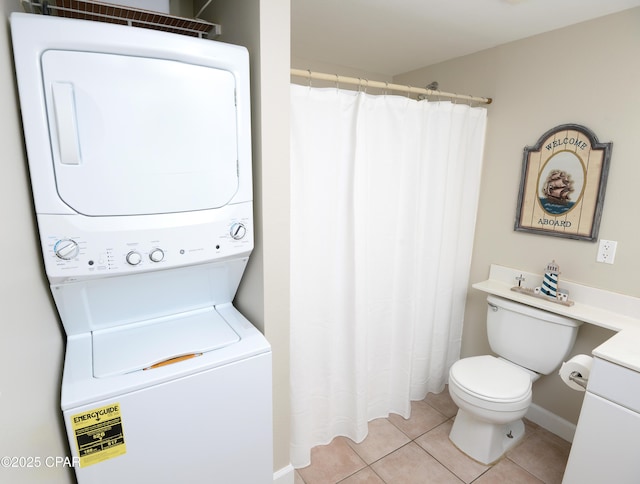 bathroom with curtained shower, stacked washer and clothes dryer, toilet, and tile patterned floors