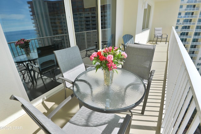 balcony featuring outdoor dining space