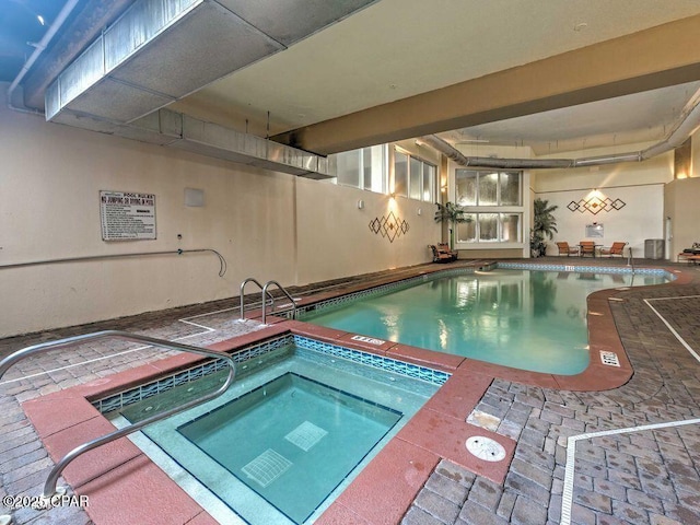 pool with an indoor hot tub