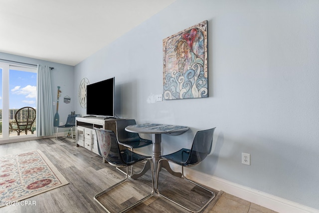 interior space featuring wood finished floors and baseboards