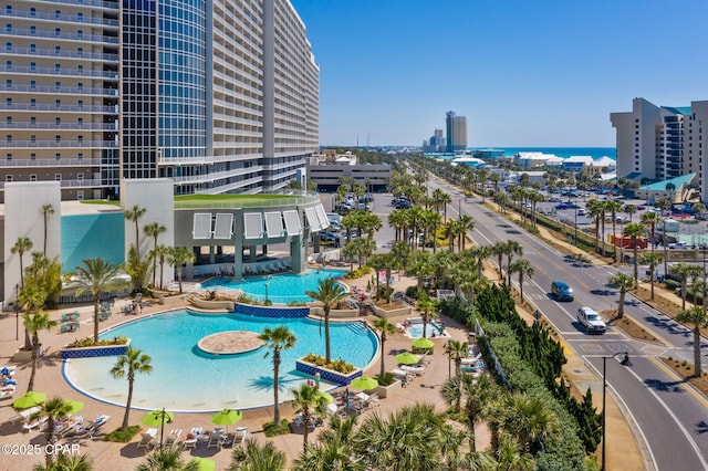 view of swimming pool with a city view