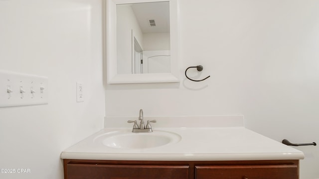 bathroom with visible vents and vanity