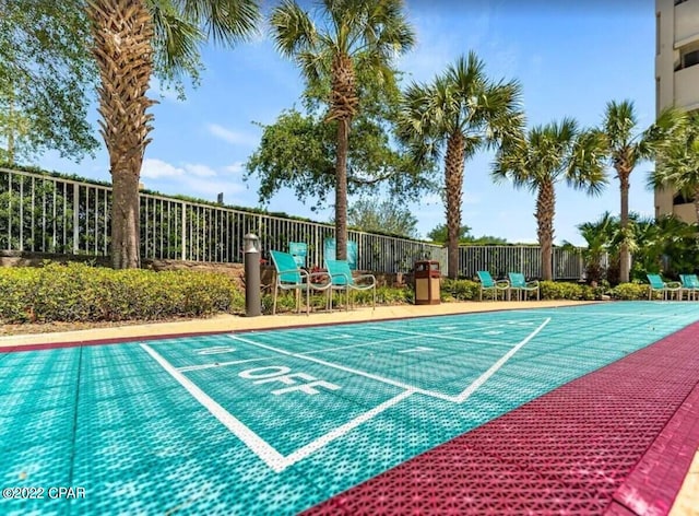 view of pool featuring fence